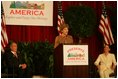 Laura Bush addresses an audience July 26, 2005 at a Preserve America neighborhoods event at the East Literature Magnet School in Nashville, Tennessee.