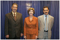 Laura Bush visits with Talib Aziz M. Zaini, Minister of Youth and Sports for Iraq, left, and Abbas Kadim Ibrahim, Director General, Ministry of Youth and Sports for Iraq, at the National Youth Summit in Washington, D.C., Friday, July 29, 2005. The Iraqi officials attended the summit to increase their understanding of youth development.