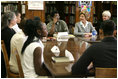 Laura Bush discusses strategies to reduce violence with Chicago's law enforcement personnel, residents, clergy, medical professionals and youth during her visit to the Chicago Project for Violence Prevention's CeaseFire Chicago program in Chicago June 2, 2005.