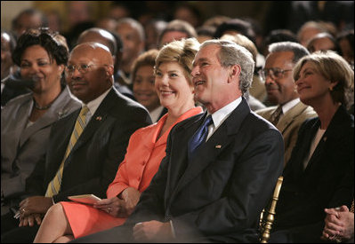 President George W. Bush, Laura Bush and HUD Secretary Alphonso Jackson, pictured at right, listen to performers during the White House reception honoring June as Black Music Month in the East Room Monday, June 6, 2005.