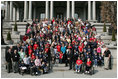 Laura Bush stands with country singer LeAnn Rimes, actor LeVar Burton and representatives of the Children's Miracle Network on the steps of the Dwight D. Eisenhower Executive Office Building near the White House Friday, March 18, 2005.