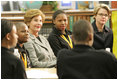 Laura Bush attends the Helping America's Youth Event at the Benjamin S. Carson Honors Preparatory School, Atlanta, Georgia, March 9, 2005, visiting a debate class with U.S. Education Secretary Margaret Spellings.