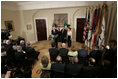 Irish Taoiseach Bertie Ahern delivers remarks before presenting President George W. Bush with the traditional bowl of shamrocks during a St. Patrick's Day Shamrock Ceremony in the Roosevelt Room Thursday, March 17, 2005.