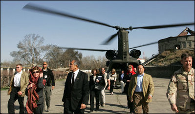 Laura Bush and U.S. Ambassador to Afghanistan Zalmay Khalilzad arrive at the Presidential Palace in Kabul, Afghanistan Wednesday, March 30, 2005.