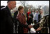 First lady Laura Bush and Margaret Spellings, Secretary of Education, center, stand with Afghan President Hamid Karzai Wednesday, March 30, 2005, after their arrival in Kabul.