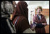 Laura Bush talks with female students in the newly built National Women’s Dormitory on the campus of Kabul University Wednesday, March 30, 2005, in Kabul, Afghanistan. The women’s dormitory was built to provide a safe place for young women to live while pursuing studies away from their families.