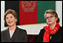 Laura Bush and U.S. Secretary of Education Margaret Spellings are seated together onstage at Kabul University Wednesday, March 30, 2005 in Kabul, Afghanistan. Mrs. Bush and Secretary Spellings toured the Women’s Teacher’s Training Institute and the National Women’s Dormitory prior to Mrs. Bush's announcement of the United States' commitment to provide more than 15 million dollars in funds for building a new university in Kabul.