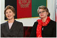 Laura Bush and U.S. Secretary of Education Margaret Spellings are seated together onstage at Kabul University Wednesday, March 30, 2005 in Kabul, Afghanistan. Mrs. Bush and Secretary Spellings toured the Women’s Teacher’s Training Institute and the National Women’s Dormitory prior to Mrs. Bush's announcement of the United States' commitment to provide more than 15 million dollars in funds for building a new university in Kabul.