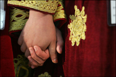 Children from the School of Hope hold hands during a visit by Laura Bush to Kabul University in Kabul, Afghanistan, Wednesday, March 30, 2005.