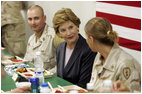 Laura Bush joins US troops as they dine in the Dragon Chow Dining Hall on Bagram Air Base in Kabul, Afghanistan Wednesday, March 30, 2005.