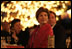 Laura Bush listens to a mariachi band perform during the White House celebration of Cinco de Mayo songs in the Rose Garden of the White House Wednesday, May 4, 2005.