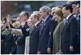 President George W. Bush and Laura Bush stand with Russian President Vladimir Putin and Lyudmila Putina, French President Jacque Chirac, far left, and Chinese President Hu Jintao, right, as many heads of state watch a parade in Moscow's Red Square commemorating the end of World War II Monday, May 9, 2005.