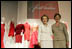 Laura Bush and Nancy Reagan appear at the opening Thursday, May 12, 2005, of The Heart Truth's First Ladies Red Dress Collection exhibit at the John F. Kennedy Center for the Performing Arts in Washington D.C.