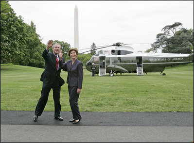 President George W. Bush and Laura Bush wave to the NCAA champions on the Truman balcony before departing the South Lawn en route Camp David Friday, May 13, 2005.