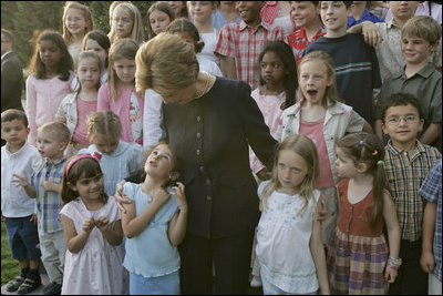 Laura Bush talks with children at the U.S. Embassy in Amman, Jordan, Saturday, May 21, 2005.