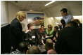 Laura Bush talks with members of the press pool aboard Air Force One during a flight to Amman, Jordan, Thursday, May 19, 2005.