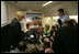 Laura Bush talks with members of the press pool aboard Air Force One during a flight to Amman, Jordan, Thursday, May 19, 2005.