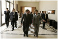 Laura Bush walks with King Abdullah II following a meeting at the Dead Sea in Jordan, Saturday, May 21, 2005.