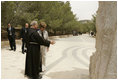 Father Michele Piccirillo, head of the Franciscan Archeology Society, discusses a monument with Laura Bush during her tour of Mount Nebo in Jordan Saturday, May 21, 2005.