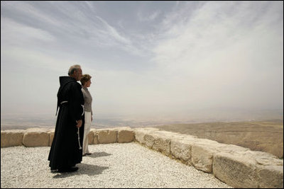 Laura Bush and Father Michele Piccirillo, head of the Franciscan Archeology Society, look out from the Judeo-Christian holy site of Mount Nebo in Jordan Saturday, May 21, 2005.