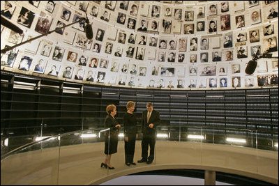 Laura Bush tours the Hall of Names with Gila Katsav, wife of President Moshe Katsav of Israel, left, and General Avner Shalev, chairman of the Yad Vashem Directorate, right, at the Yad Vashem Holocaust museum in Jerusalem, Sunday, May 22, 2005. The Hall of Names is a repository of testimony from millions of Holocaust victims and serves as a memorial to those who died.