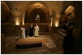 Brother Olivier, prior of the monastery, discusses the historical significance of the Church of the Resurrection at Abu Gosh, during Laura Bush's visit to the monastery in Israel, May 23, 2005.