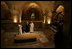 Brother Olivier, prior of the monastery, discusses the historical significance of the Church of the Resurrection at Abu Gosh, during Laura Bush's visit to the monastery in Israel, May 23, 2005.