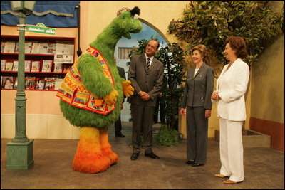 Laura Bush and Suzanne Mubarak, wife of Egyptian President Hosni Mubarak, right, meet children's television character Nimnim, left, and Amr Koura, CEO of Alkarma Endutainment, before taking a segment for the "Alam Simsim" show in Cairo, Egypt, May 23, 2005. The program offers educational curriculum in an inventive way that puts fun into learning for Egyptian children.