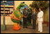 Laura Bush and Suzanne Mubarak, wife of Egyptian President Hosni Mubarak, right, meet children's television character Nimnim, left, and Amr Koura, CEO of Alkarma Endutainment, before taking a segment for the "Alam Simsim" show in Cairo, Egypt, May 23, 2005. The program offers educational curriculum in an inventive way that puts fun into learning for Egyptian children.