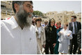 Laura Bush departs the Western Wall after inserting a prayer in the wall and taking a tour of the model of Mount Moriah Sunday, May 22, 2005.