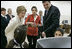 Laura Bush and Queen Raina Al-Abdullah, wife of King Abdullah of Jordan, center, talk with students during a computer lab at the Discovery School of Swaifiyeh Secondary School in Amman, Jordan, Sunday, May 22, 2005.