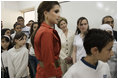 Queen Raina Al-Abdullah, wife of King Abdullah of Jordan, center, and Laura Bush listen to a computer lab presentation at the Discovery School of Swaifiyeh Secondary School in Amman, Jordan, Sunday, May 22, 2005. The school is one of 100 in the country that have developed Internet curriculum to help reform Jordanian education.