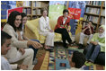 Soraya Sulti, regional director of INJAZ, left, and students at the Discovery School of Swaifiyeh Secondary School in Amman, Jordan, share their experiences with INJAZ with Laura Bush and Queen Raina, center right, May 22, 2005. INJAZ promotes entrepreneurship and community leadership among Jordan's youth by teaching entrepreneurship, business ethics, leadership and community involvement.