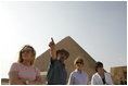 Dr. Zahi Hawass, secretary general of the Supreme Council of Antiquities, shows Liz Cheney, left, Laura Bush and Anita McBride, chief of staff for Mrs. Bush, right, the Giza Pyramids and a new excavation site in Giza, Egypt, Monday, May 23, 2005.