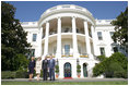 President George W. Bush and Laura Bush welcome the Prince of Wales and Duchess of Cornwall to the White House, Wednesday, Nov. 2, 2005.