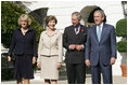 President George W. Bush and Laura Bush welcome the Prince of Wales and Duchess of Cornwall to the White House, Wednesday, Nov. 2, 2005.