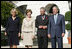 President George W. Bush and Laura Bush welcome the Prince of Wales and Duchess of Cornwall to the White House, Wednesday, Nov. 2, 2005.