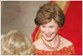 Laura Bush welcomes the Duchess of Cornwall upon the arrival of the Prince of Wales and the Duchess to the White House, Wednesday evening, Nov. 2, 2005.