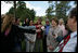 Mrs. Laura Bush smiles as she talks with the media after lunching Friday, Nov. 4, 2005, at Estancia Santa Isabel, an Argentine ranch located not far from Mar del Plata, where President George W. Bush was participating in the 2005 Summit of the Americas.