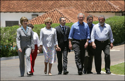 President George W. Bush and Brazil President Luiz Inacio Lula da Silva are joined by their wives, Laura Bush and Marisa Leticia da Silva, as they walk the grounds of President da Silva's Granja do Torto Saturday, Nov. 6, 2005.