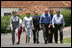 President George W. Bush and Brazil President Luiz Inacio Lula da Silva are joined by their wives, Laura Bush and Marisa Leticia da Silva, as they walk the grounds of President da Silva's Granja do Torto Saturday, Nov. 6, 2005.