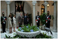 President George W. Bush and Mrs. Bush are welcomed Monday, Nov. 7, 2005, by Panama's President Martin Torrijos and his wife, Vivian, -- and a pet bird -- at the Palacio de Las Garzas in Panama City, Panama.