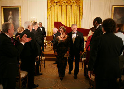 President George W. Bush and Mrs. Laura Bush are applauded at the conclusion of festivities at the White House, Thursday, Nov. 10, 2005, following the evening's celebration of the 40th Anniversary of the National Endowment for the Arts and the National Endowment for the Humanities.