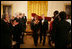 President George W. Bush and Mrs. Laura Bush are applauded at the conclusion of festivities at the White House, Thursday, Nov. 10, 2005, following the evening's celebration of the 40th Anniversary of the National Endowment for the Arts and the National Endowment for the Humanities.