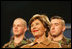 Mrs. Laura Bush smiles as she listens to the President’s introduction Monday, Nov. 14, 2005, at Elmendorf Air Force Base in Anchorage, Alaska, where he delivered remarks on the War on Terror to the troops.