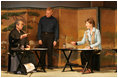 Mrs. Laura Bush receives instruction on calligraphy from Master Minoru Sawada, head calligraphy master of the Origin Arts Program, as Alex Kerr, author and Chairman of the Iori Co., looks on.