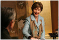 Mrs. Laura Bush smiles during an exchange Wednesday, Nov. 16, 2005, with Master Minoru Sawada, head calligraphy master of the Origin Arts Program, at the Suchiya-cho Townhouse in Kyoto, Japan.