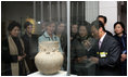 Mrs. Laura Bush looks through exhibition glass at a piece of pottery Thursday, Nov. 17, 2005, during her tour of Gyeongju National Museum in Gyeongju, Korea. With her at right is Mrs. Yang-Sook Kwon, wife of Korea President Moo Hyun Roh.