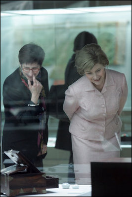 Laura Bush and Lisa Vershbow, left, wife of Alexander Vershbow, the U.S. Ambassador to Korea, look at exhibits at the Busan Museum Saturday, Nov. 19, 2005, in Busan, Korea.