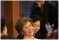 Laura Bush sits with women leaders during a discussion Saturday, Nov. 19, 2005, at the Dong Nae Byel Jang Restaurant in Busan, Korea.